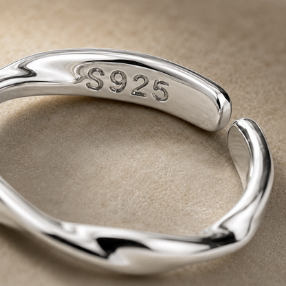 Close-up of the polished twisted band and S925 stamp on the sterling silver adjustable ring