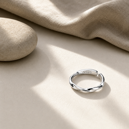 ModClo sterling silver twisted ring styled with linen and stone in a warm, minimal setting